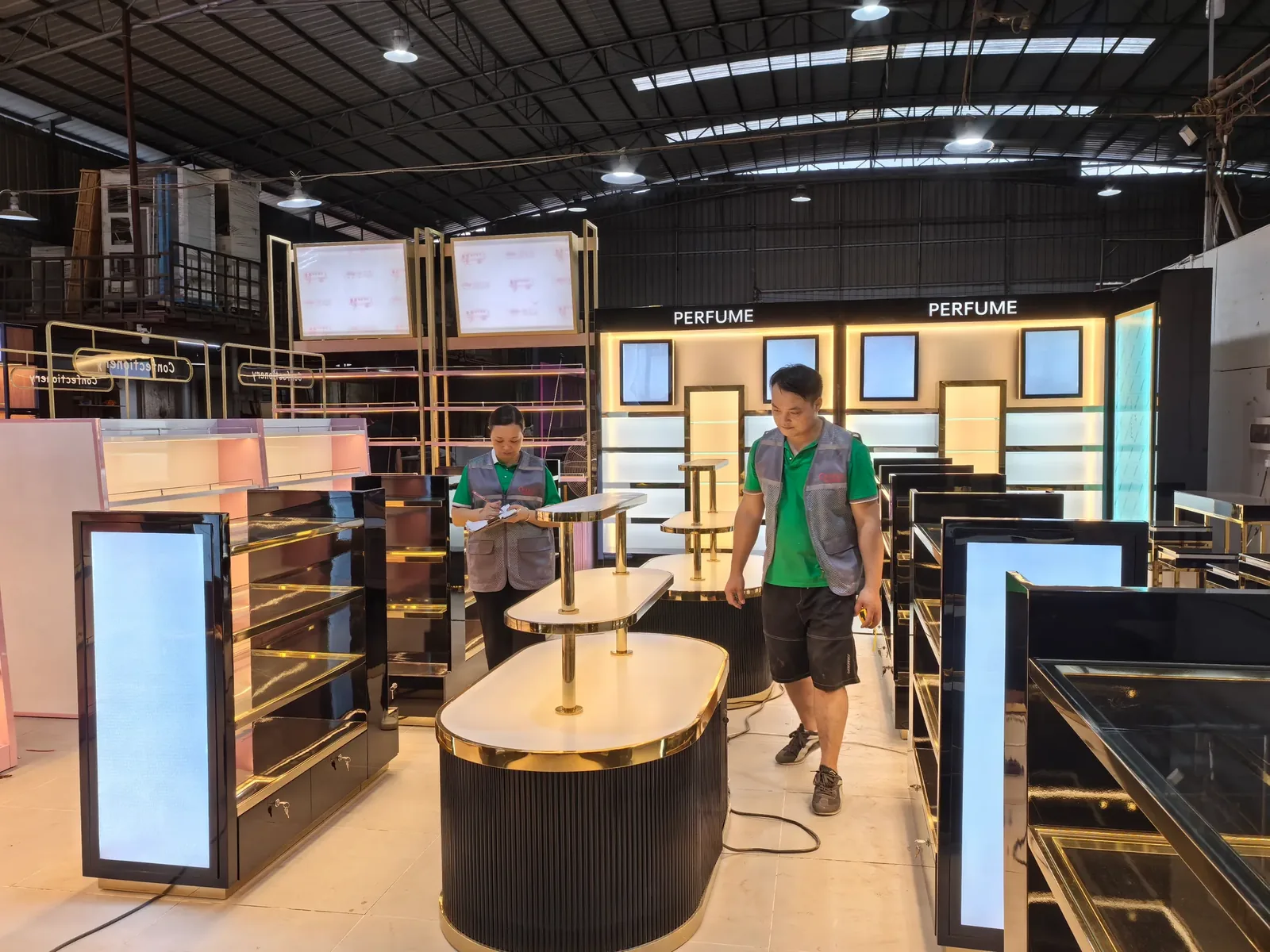 Staff inspecting assembled retail fixtures