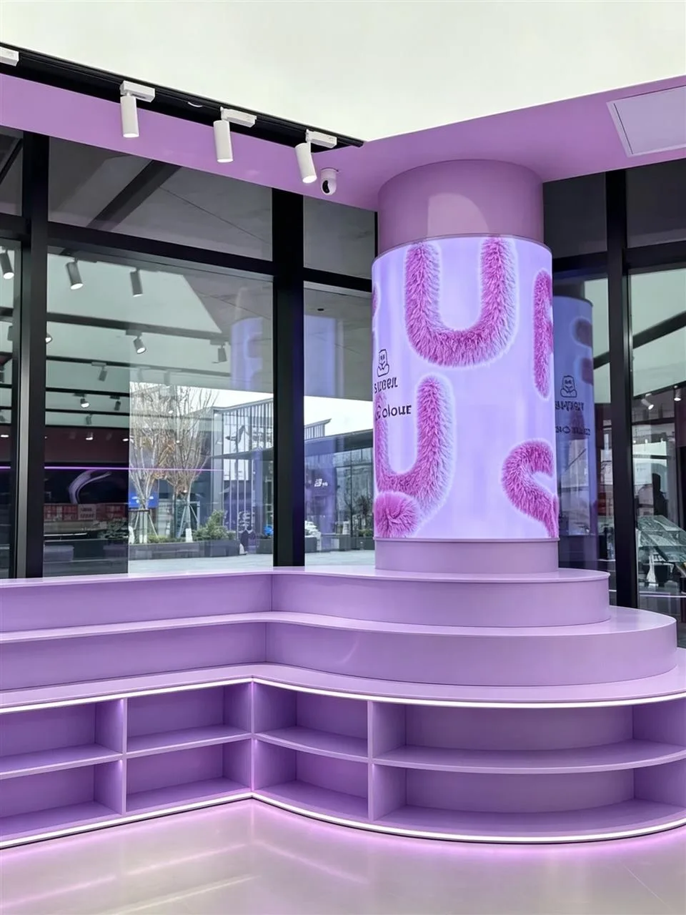 Lavender Sloped Display Table and Empty Wall Bays — reference view 5 of 5