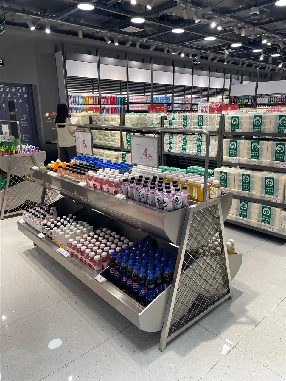 Low Gray Merchandise Table with Stepped Product Rows — reference view 3 of 10