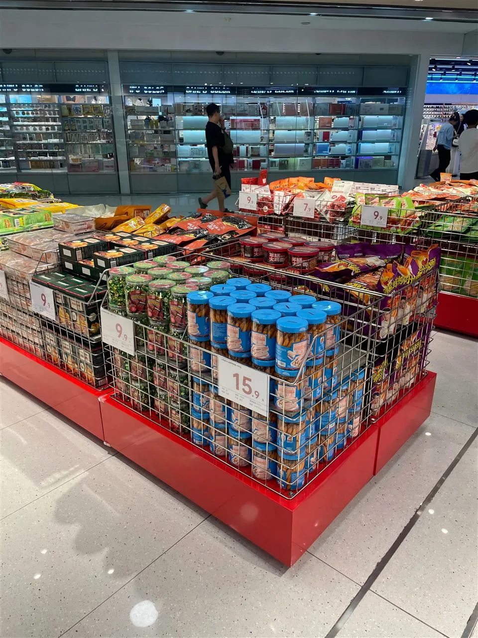 Low Gray Merchandise Table with Stepped Product Rows — reference view 6 of 10