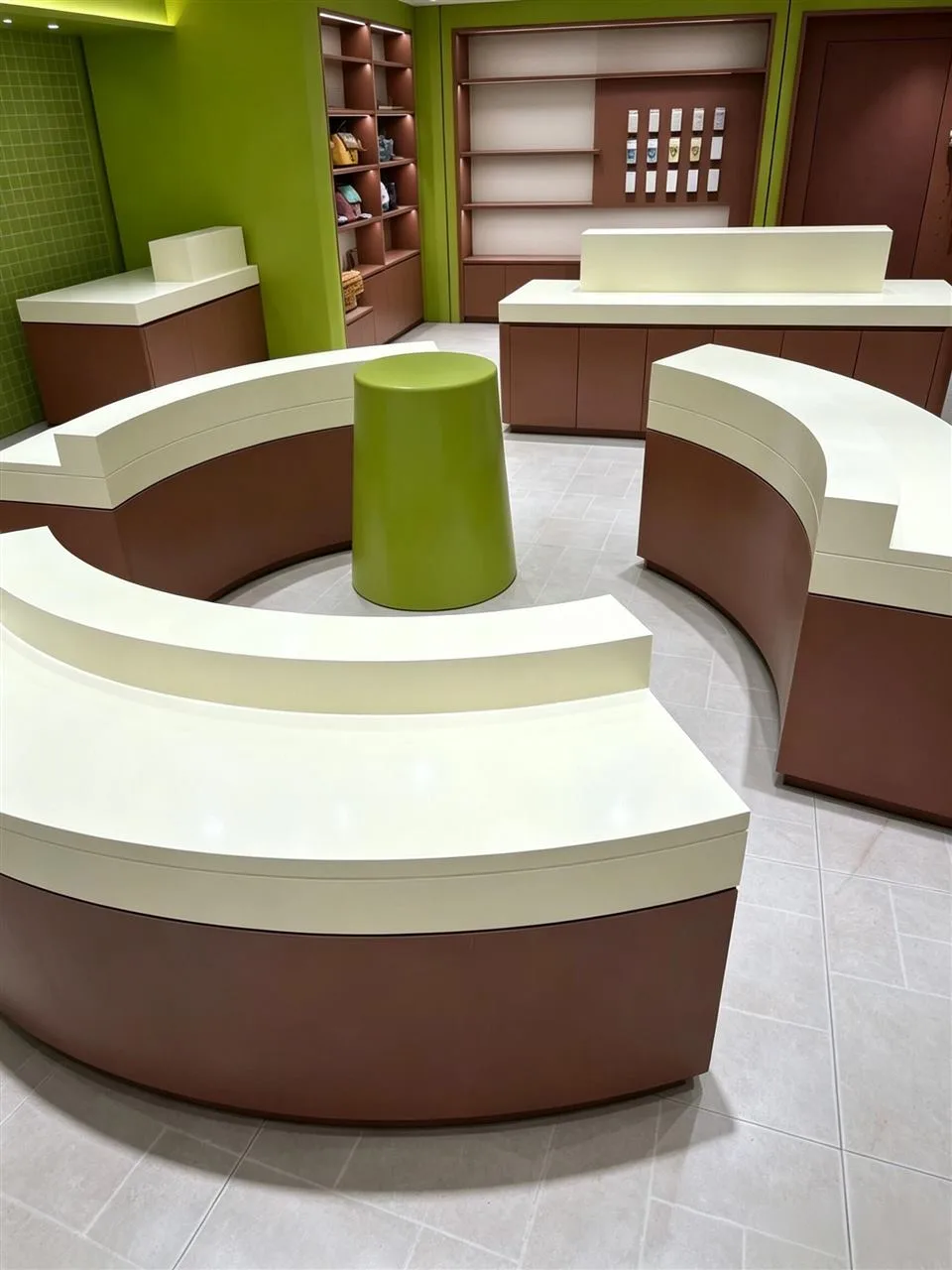 Curved Brown Retail Tables and Green Column Shelves — reference view 2 of 4