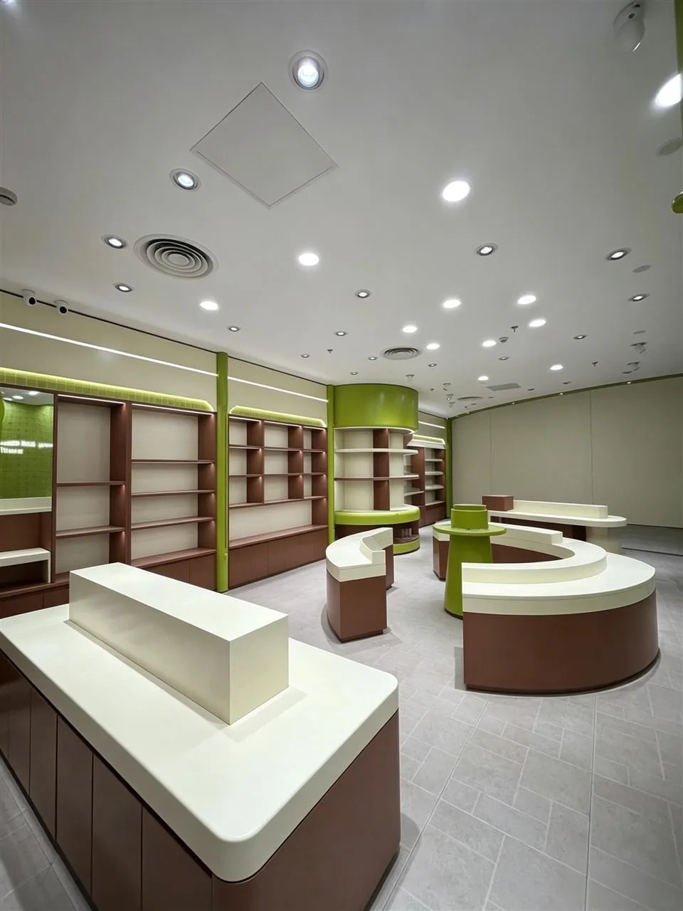 Curved Brown Retail Tables and Green Column Shelves — reference view 4 of 4