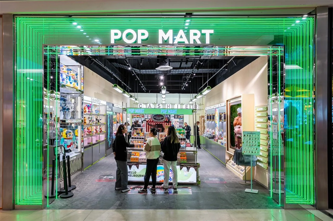 Green-Lit Toy Store Entrance Reference — reference view 4 of 8