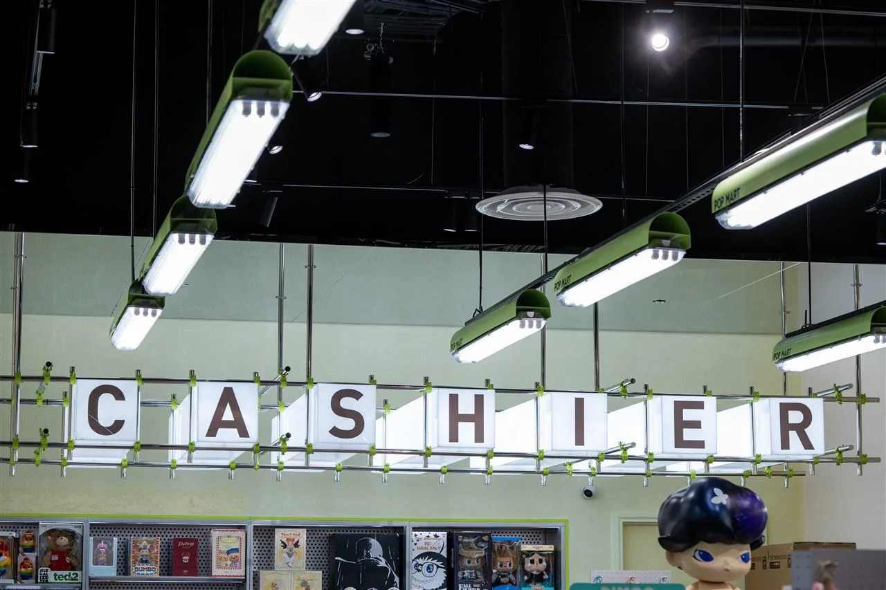 Green-Lit Toy Store Entrance Reference — reference view 7 of 8