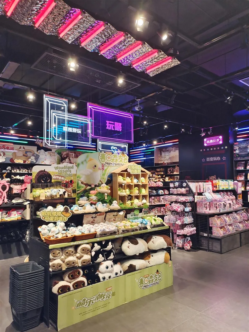 Dark Neon Collectible Store with Hanging Sign Frames — reference view 2 of 4