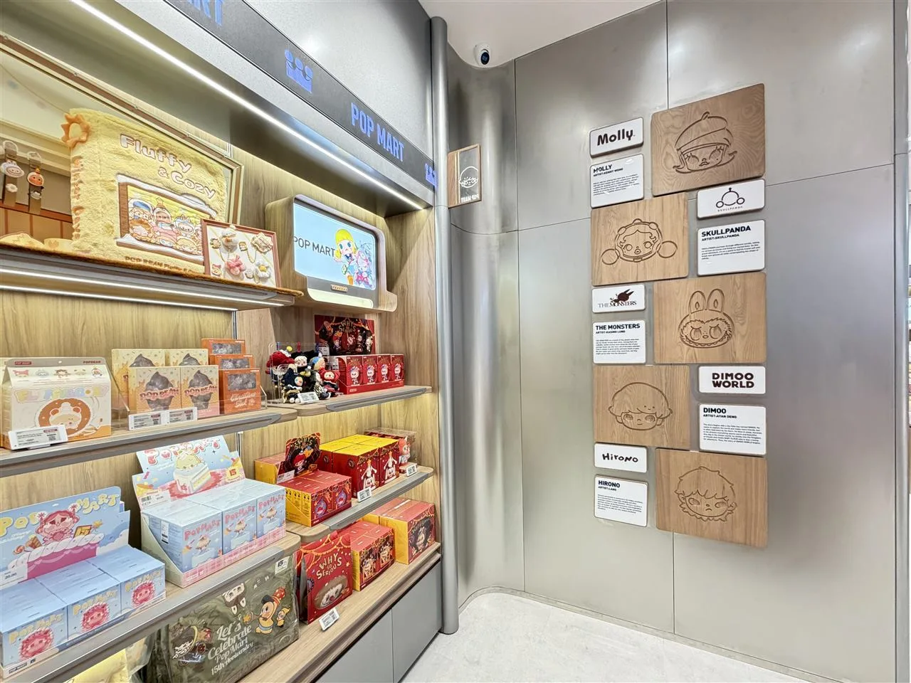 Pale Toy Storefront with Broad Illuminated Fascia — reference view 5 of 8