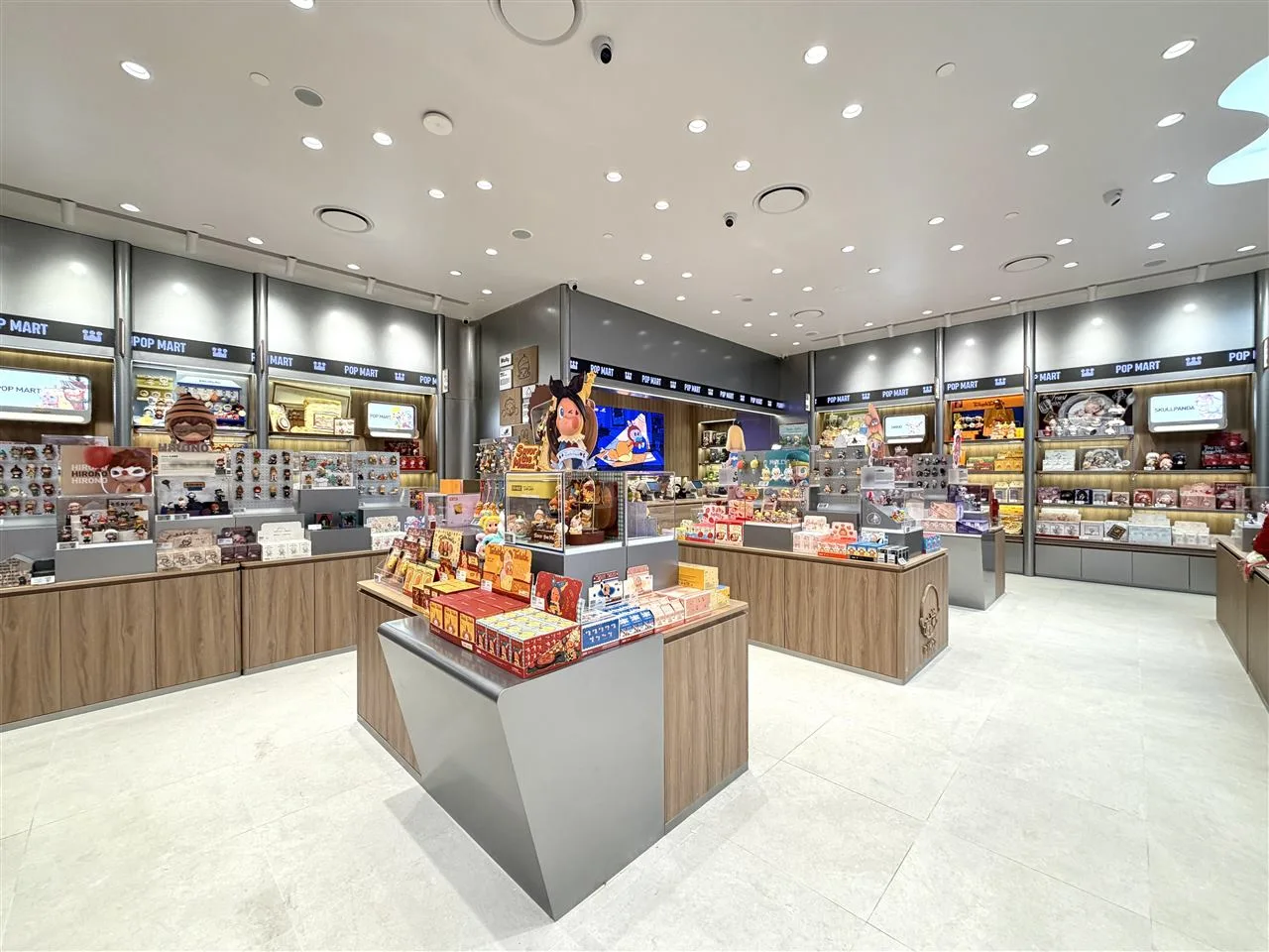 Pale Toy Storefront with Broad Illuminated Fascia — reference view 7 of 8